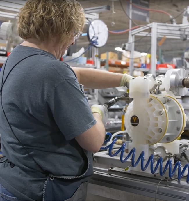 Warren Rupp team member assembling pump